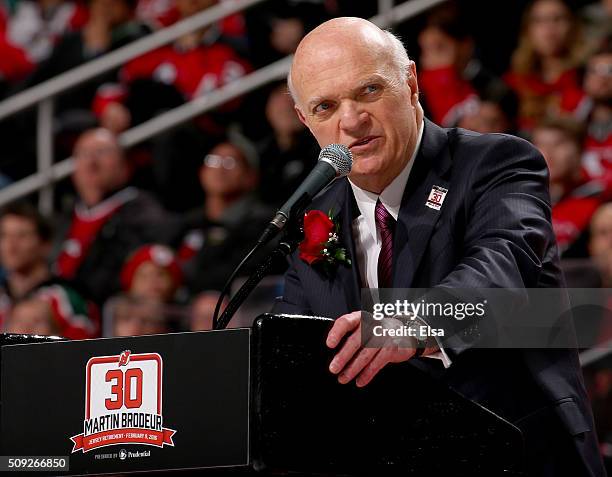 Lou Lamoriello addresses the fans during the former New Jersey Devils goaltender Martin Brodeur jersey retirement ceremony before the game between...