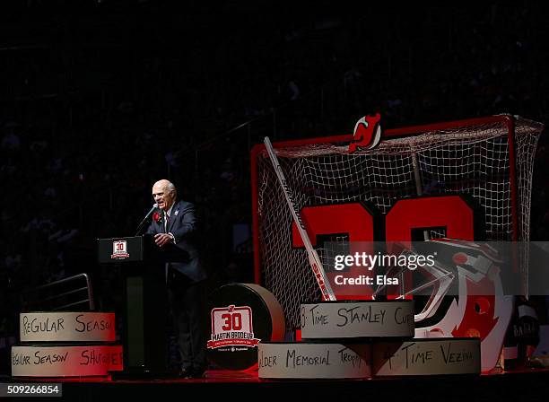 Lou Lamoriello addresses the fans during the former New Jersey Devils goaltender Martin Brodeur jersey retirement ceremony before the game between...