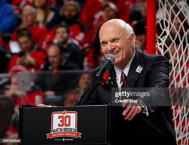 Lou Lamoriello addresses the fans during the former New Jersey Devils goaltender Martin Brodeur jersey retirement ceremony before the game between...