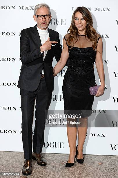 Patrick Cox and Elizabeth Hurley attend at Vogue 100: A Century of Style at the National Portrait Gallery on February 9, 2016 in London, England.