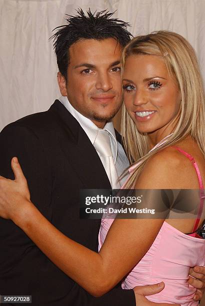 Peter Andre and Jordan arrive for the penultimate day of filming of television program "Hell's Kitchen" at Brick Lane on June 4, 2004 in London....