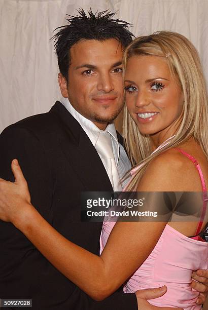 Peter Andre and Jordan arrive for the penultimate day of filming of television program "Hell's Kitchen" at Brick Lane on June 4, 2004 in London....