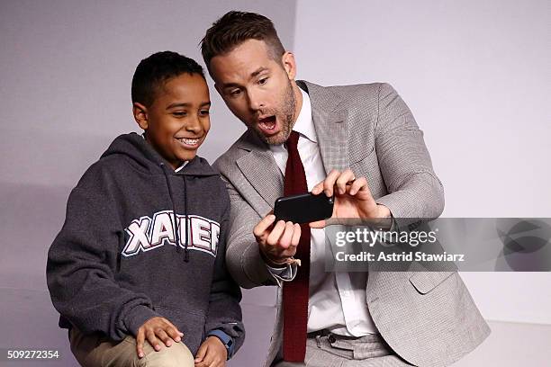 Actor Ryan Reynolds poses for a selfie with a fan during Apple Store Soho Presents Meet The Actor: Ryan Reynolds, Morena Baccarin, T.J. Miller, and...