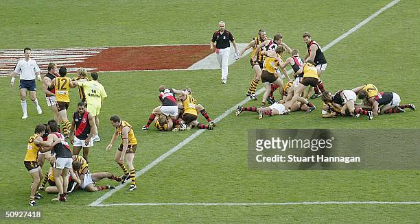 Essendon and Hawthorn players during an all in mellee in the round eleven AFL match between the Hawthorn Hawks and the Essendon Bombers at the...