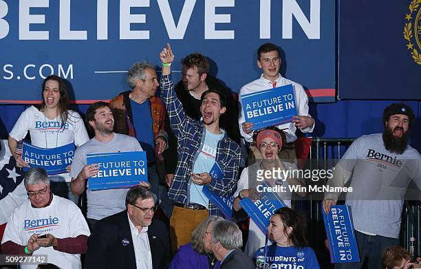 Bernie Sanders supporters cheer waiting for the candidate to come out at the candidate's New Hampshire Primary Night watch party February 9, 2016 in...