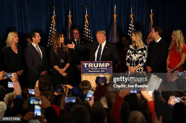 Republican presidential candidate Donald Trump speaks as his wife Melania Trump and daughter Ivanka Trump look on after Primary day at his election...