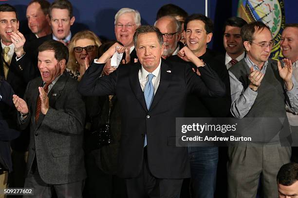 Republican presidential candidate Ohio Governor John Kasich arrives on stage at a campaign gathering with supporters upon placing second place in the...