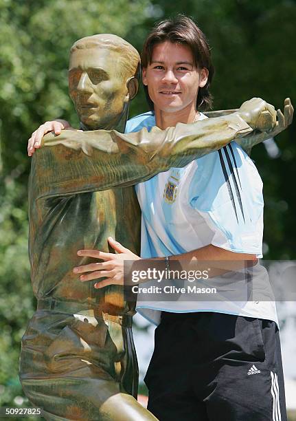 Guillermo Coria of Argentina poses at the Jacques Brugnon statue prior to his mens final match tomorrow during Day Thirteen of the 2004 French Open...