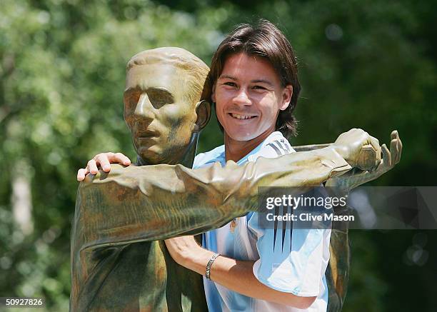 Guillermo Coria of Argentina poses at the Jacques Brugnon statue prior to his mens final match tomorrow during Day Thirteen of the 2004 French Open...