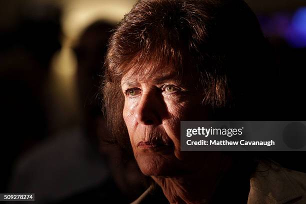 Supporter watches Republican presidential candidate Donald Trump speak after Primary day at his election night watch party at the Executive Court...