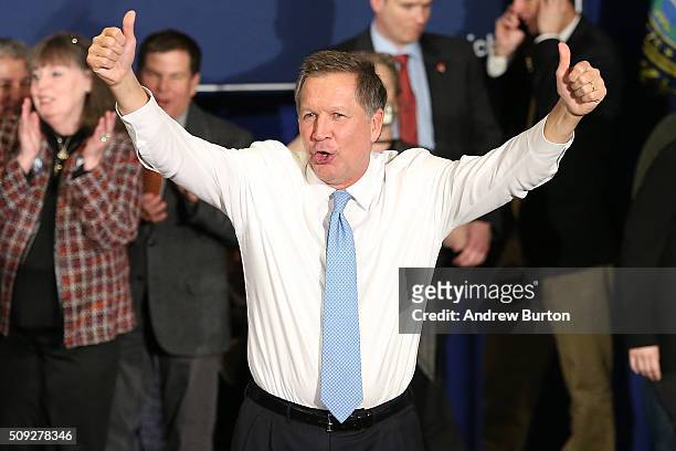 Republican presidential candidate Ohio Governor John Kasich waves to the crowd after speaking at a campaign gathering with supporters upon placing...