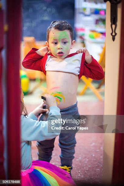 boy with painted belly button - male belly button stock pictures, royalty-free photos & images