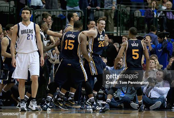 Gordon Hayward of the Utah Jazzcelebrates with his team after shooting the game winning basket against Zaza Pachulia of the Dallas Mavericks in...