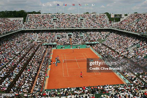 Anastasia Myskina of Russia returns in her womens final match against Elena Dementieva of Russia during Day Thirteen of the 2004 French Open Tennis...