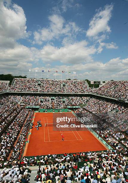 Elena Dementieva of Russia serves in her womens final match against Anastasia Myskina of Russia during Day Thirteen of the 2004 French Open Tennis...