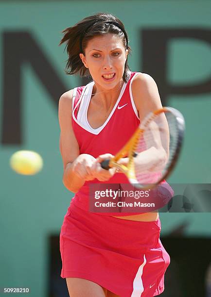 Anastasia Myskina of Russia plays a return during her womens final match against Elena Dementieva of Russia on Day Thirteen of the 2004 French Open...