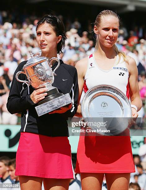 Anastasia Myskina of Russia and Elena Dementieva of Russia pose with their trophies after Anastasia beat Elena in the womens final match during Day...