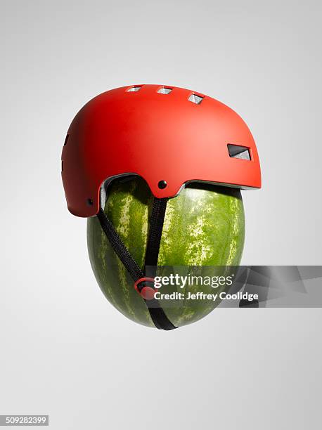 watermelon with helmet - protection helmet stock-fotos und bilder