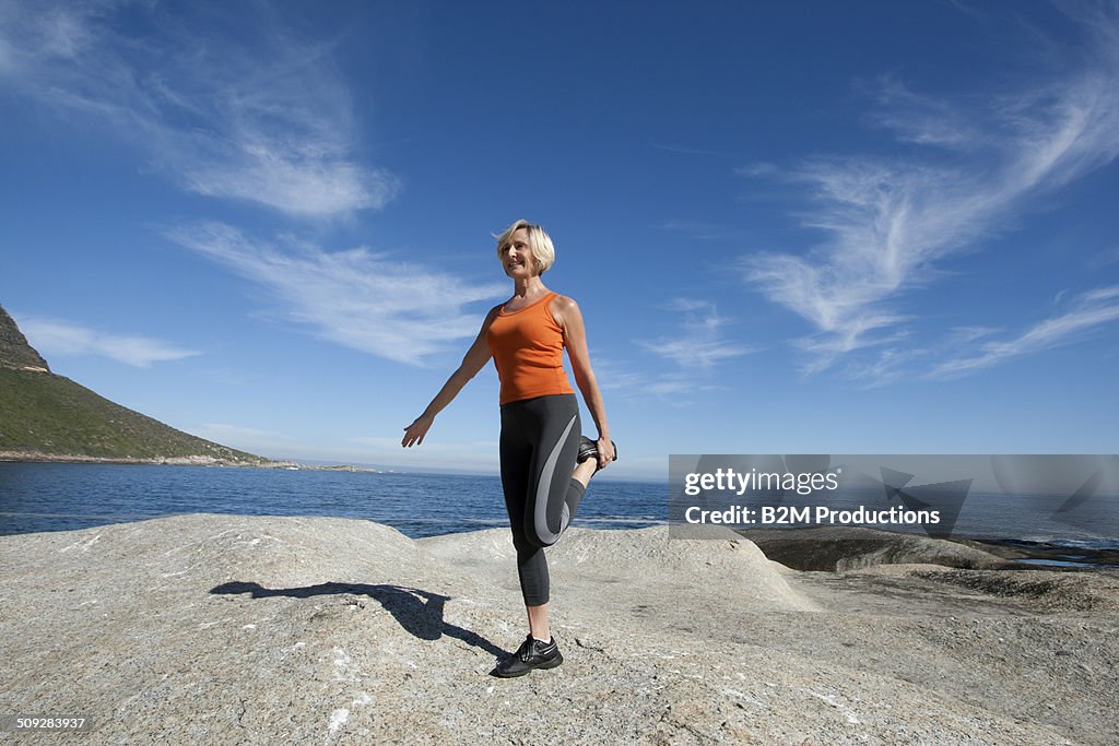 Woman Exercising On Beach