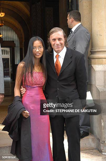 Former tennis champion, Argentinian Guillermo Villas and his partner leave St-Stephane orthodox church after the religious wedding of former tennis...