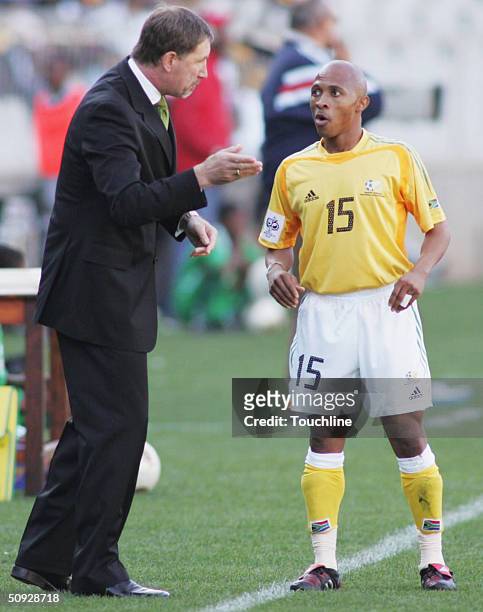 South Africa coach Stuart Baxter talks with Benedict Vilakazi during the 2006 World Cup Qualifying match between South Africa and Cape Verde played...