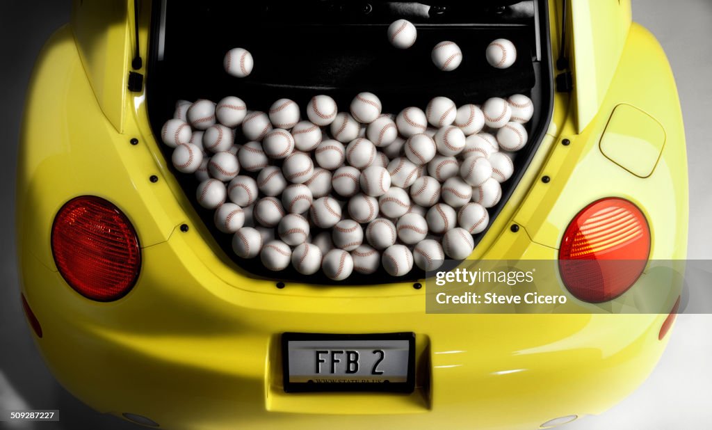 Vehicle trunk full of baseballs