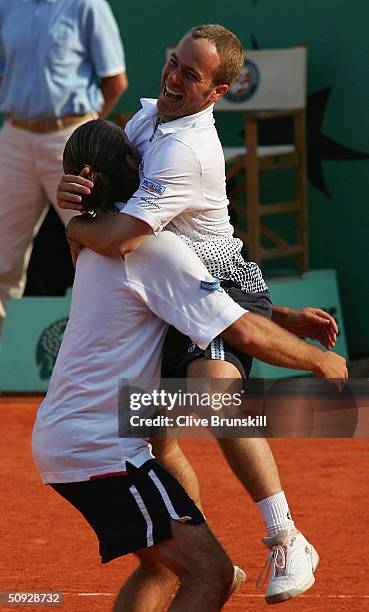 Xavier Malisse and Olivier Rochus of Belgium celebrate after winning their mens doubles final match against Michael Llodra and Fabrice Santoro of...