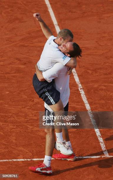 Xavier Malisse and Olivier Rochus of Belgium celebrate after winning their mens doubles final match against Michael Llodra and Fabrice Santoro of...