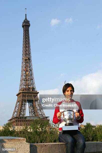 Anastasia Myskina of Russia poses with the trophy after winning her women's final match against Elena Dementieva of Russia during Day Thirteen of the...