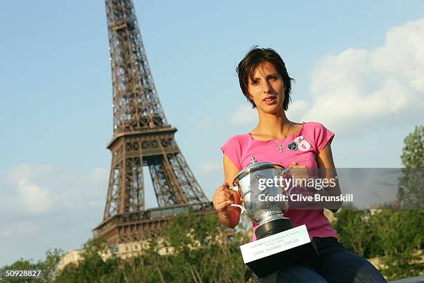 Anastasia Myskina of Russia poses with the trophy after winning her women's final match against Elena Dementieva of Russia during Day Thirteen of the...
