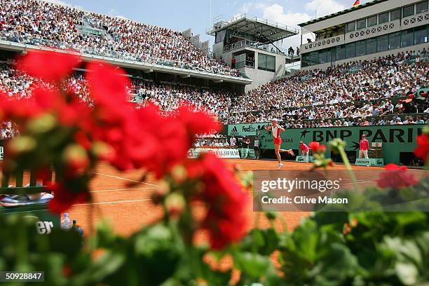 Elena Dementieva of Russia returns in her womens final match against Anastasia Myskina of Russia during Day Thirteen of the 2004 French Open Tennis...