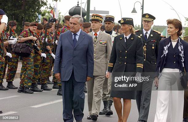 French Prime Minister Jean-Pierre Raffarin , Princess Astrid of Belgium and Princess Margaretha of Luxembourg inspect the troops, 05 June 2004 in...
