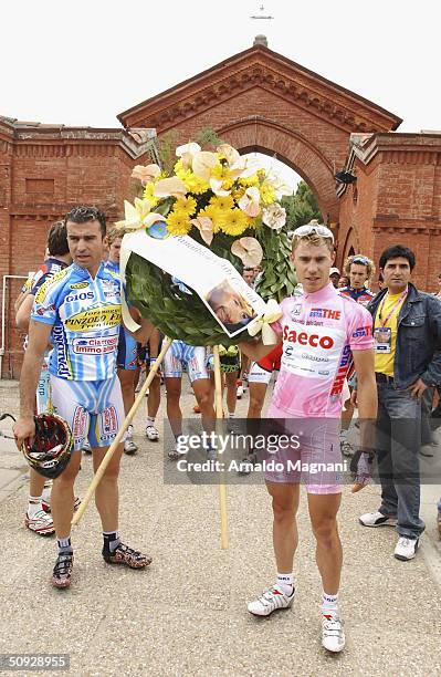 Giro D'Italia winner Damiano Cunego visits a memorial to cyclist Marco Pantani is seen June 5, 2004 in Cesenatico, Italy. Pantani died February 14,...