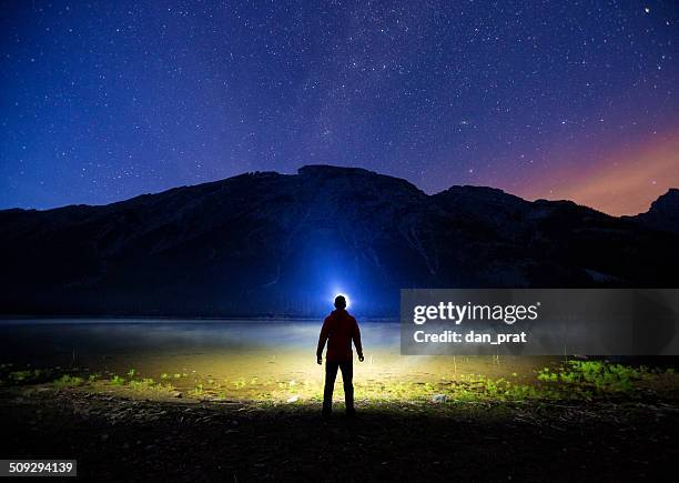under the stars - head torch stock pictures, royalty-free photos & images