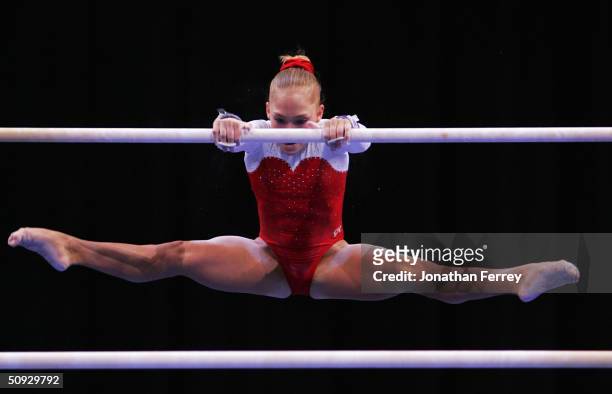 Courtney McCool competes on the uneven bars during the 2004 U.S. Gymnastics Championships on June 5, 2004 at the Gaylord Entertainment Center in...