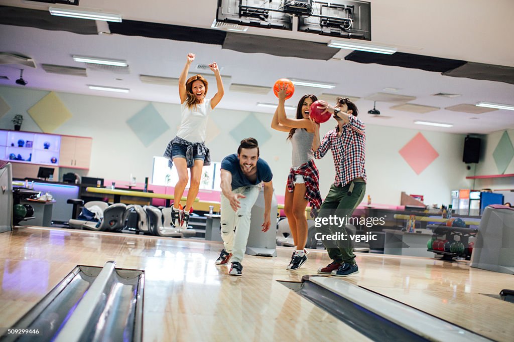 Cheerful Friends Bowling Together