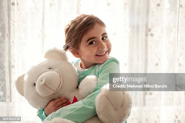 cute girl hugging each other her teddy - doll stock pictures, royalty-free photos & images