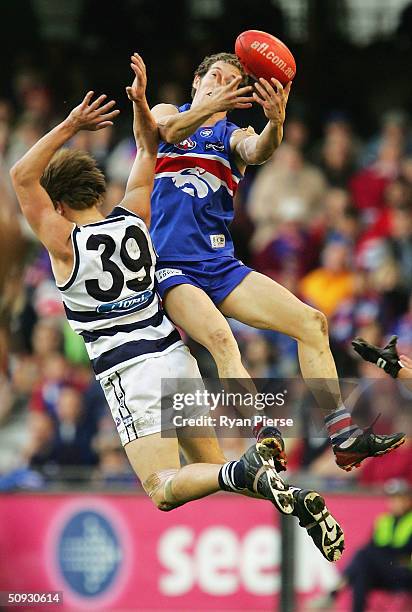 Robert Murphy for the Bulldogs marks over Darren Milburn for the Cats during the round eleven AFL match between The Western Bulldogs and the Geelong...