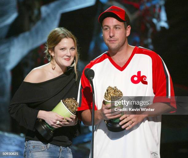 Actors Drew Barrymore and Adam Sandler accept the award for "Best On-Screen Team" at the 2004 MTV Movie Awards at the Sony Pictures Studios on June...