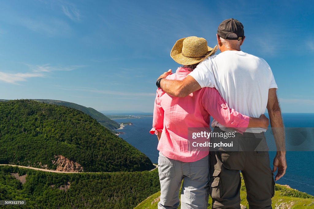 Couple looking at landscape, Skyline, Cabot trail, Cape Breton