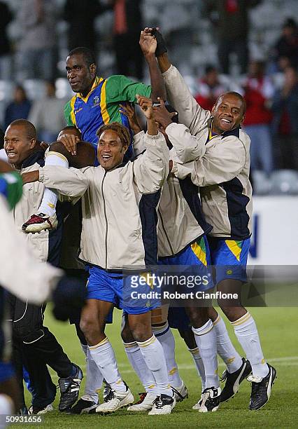 June 6: Commins Menapi of the Solomon Islands is held aloft after Solomon Islands held Australia to a two all draw to qualify for the next phase of...