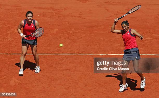 Paola Suarez of Argentina and Virginia Ruano Pascual of Spain return in their womens doubles final match against Svetlana Kuznetsova and Elena...