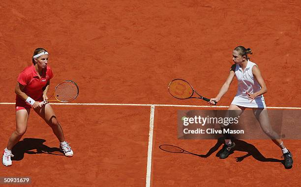 Svetlana Kuznetsova and Elena Likhovtseva of Russia return in their womens doubles final match against Paola Suarez of Argentina and Virginia Ruano...