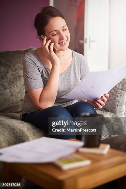 happy woman on the phone with the finance company - debt free stock pictures, royalty-free photos & images