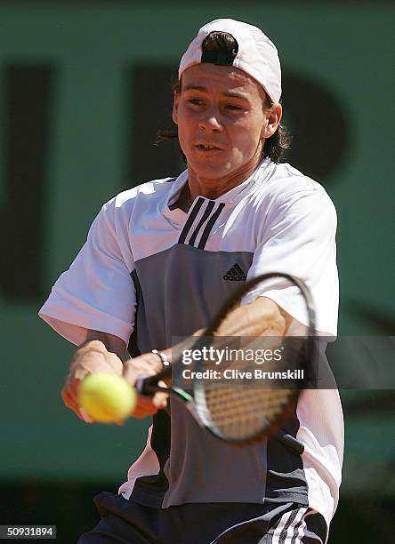 Guillermo Coria of Argentina returns in his men's final match against Gaston Gaudio of Argentina during Day Fourteen of the 2004 French Open Tennis...