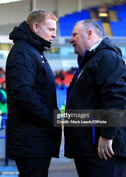 Bolton manager Neil Lennon speaks to Leeds manager Steve Evans before the Emirates FA Cup Fourth Round match between Bolton Wanderers and Leeds...