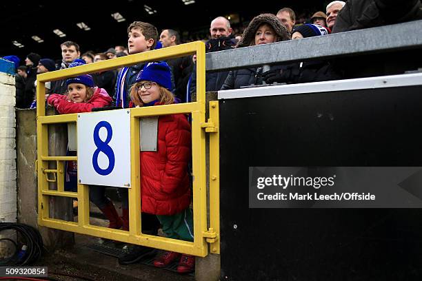 Young girls peer through the gate during the Emirates FA Cup Fourth Round match between Carlisle United and Everton at Brunton Park on January 31,...