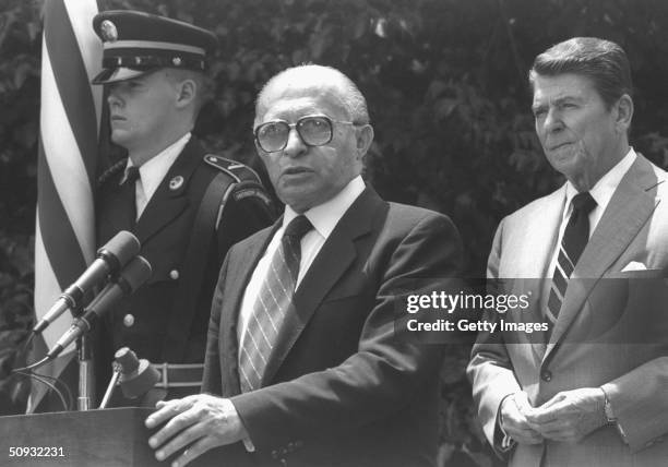 President Ronald Reagan and Israeli Prime Minister Menahem Begin address the press in the White House gardens June 21, 1982 in Washington, DC....