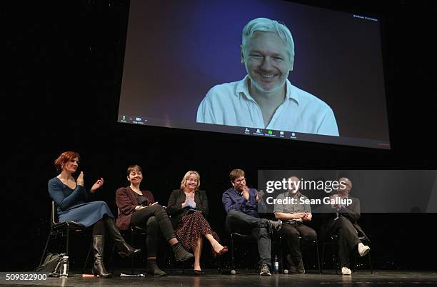 Australian activist Julian Assange speaks via a live broadcast at the official launch of the Democracy in Europe Movement 2025 as left-leaning...