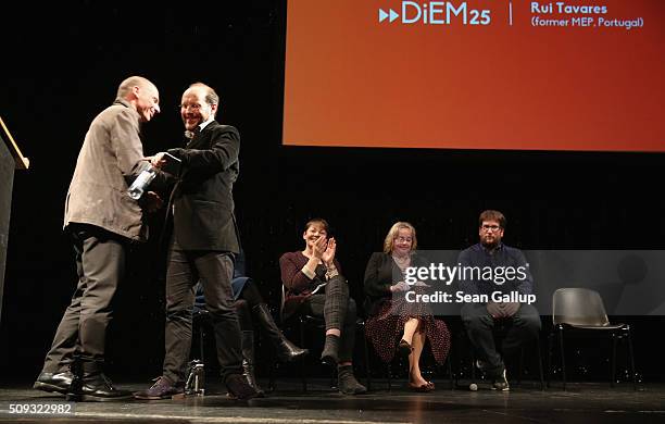 Former Greek Finance Minister Yanis Varoufakis embraces Rui Tavares of Portugal after Tavares spoke at the official launch of the Democracy in Europe...